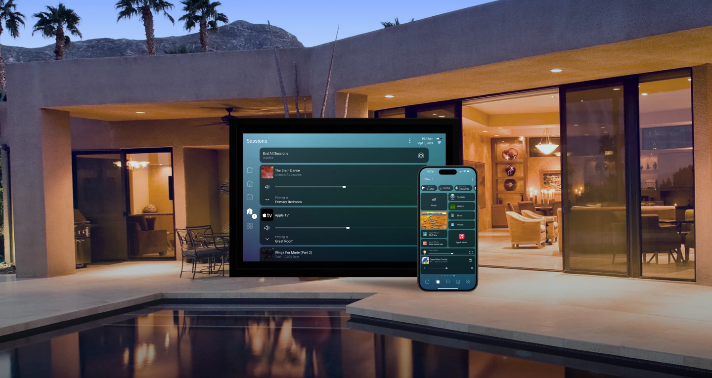 A luxury home at dusk controlled by Control4 on a touchscreen and phone