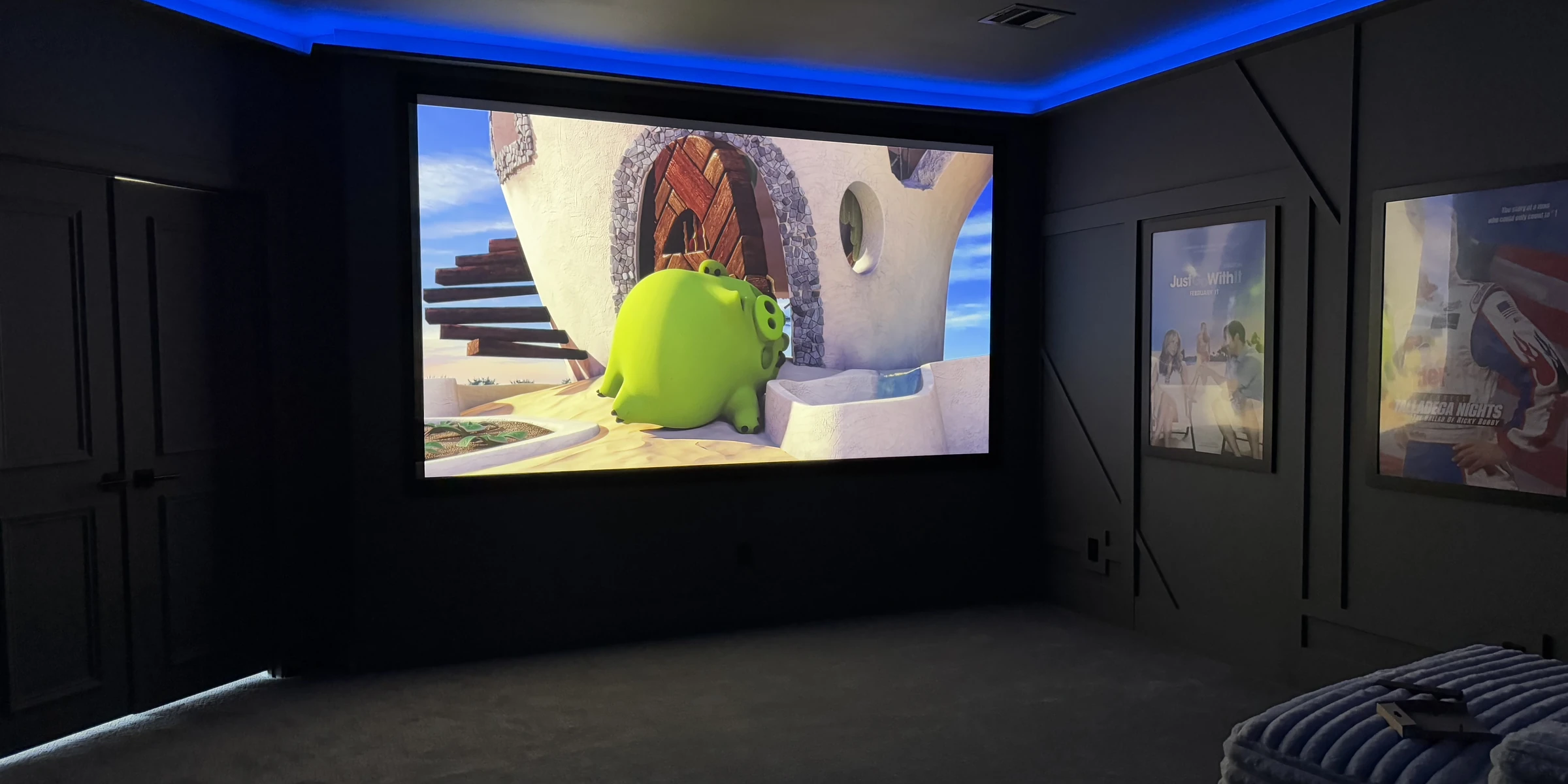 A theater we built - blue cove lighting, film posters, the screen alive
